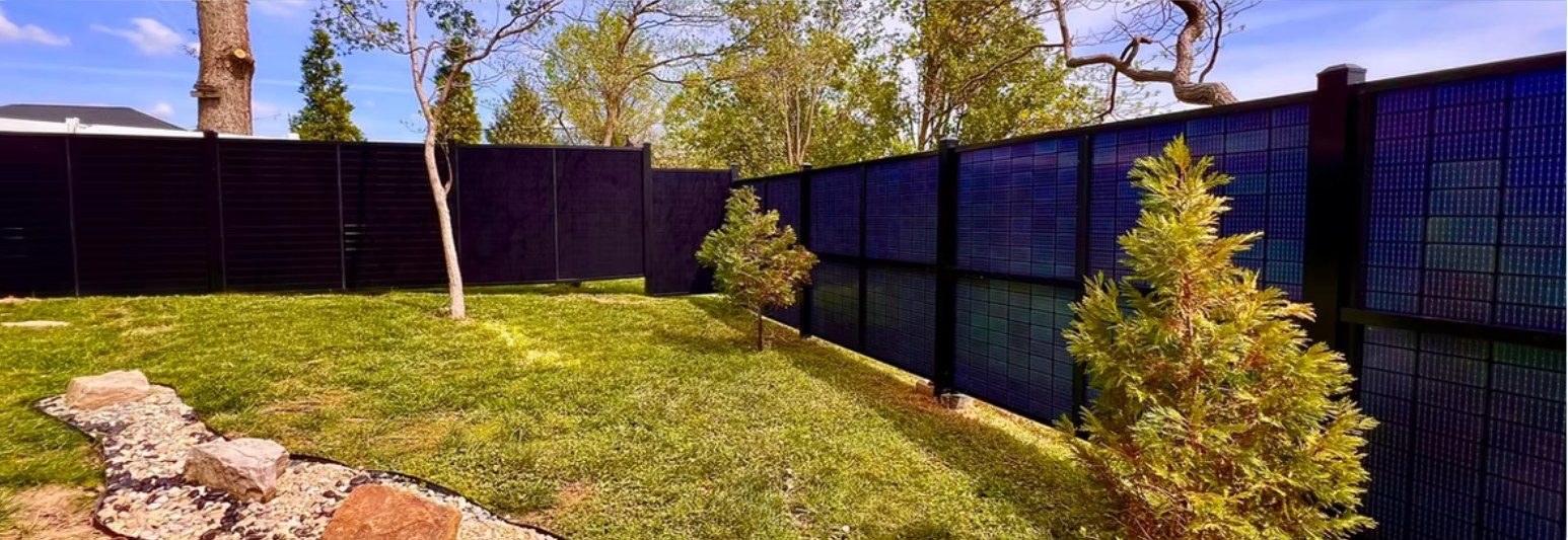 SolFence solar privacy fence along a back yard